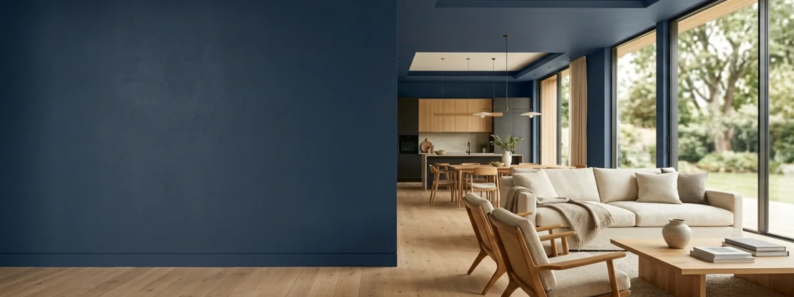 Wide modern interior with deep navy painted walls