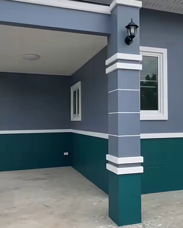 Charcoal and teal exterior walls with white column details