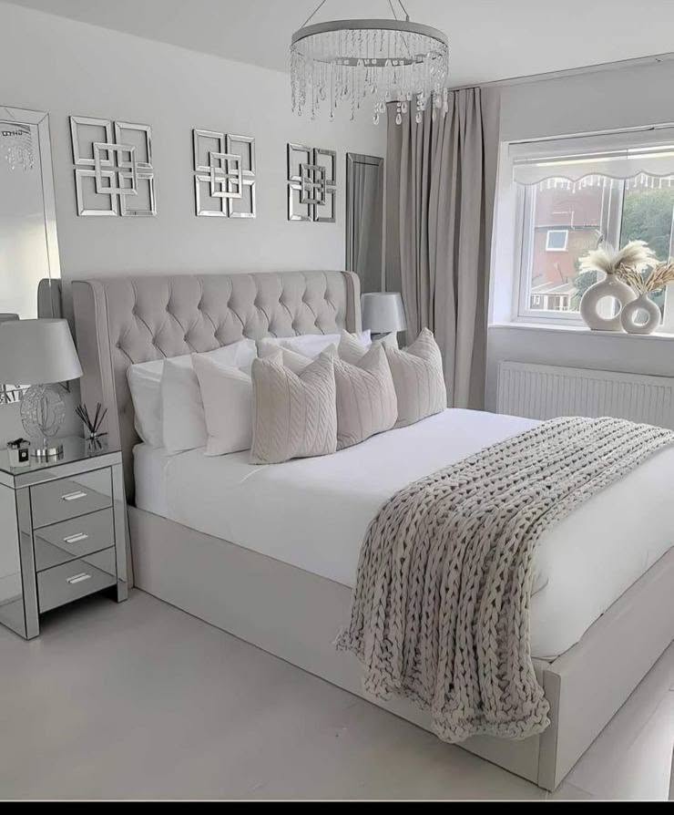 Soft white bedroom with a clean monochrome finish